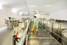 Brewery Beverage Factory Worker Working Check Fermentation Tank With Clean And Hygiene Cover Suit.