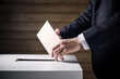 © FotoIdee - Close-Up Of A Citizen Casting Their Ballot And Participating In The Democratic Election Process - Generative AI