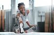 © Beaunitta Van Wyk/peopleimages.com - Gym, happy or portrait of black woman stretching legs for workout or body movement for active fitness. Smile, athlete or healthy girl smiling in exercise training warm up for flexibility or mobility