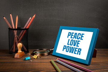 Wall Mural - Peace Love Power. Text in the picture frame