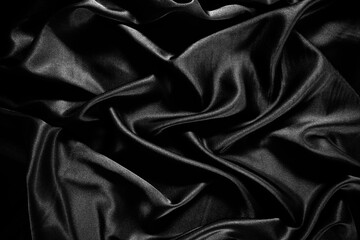 Fototapete - Black silk satin texture background.