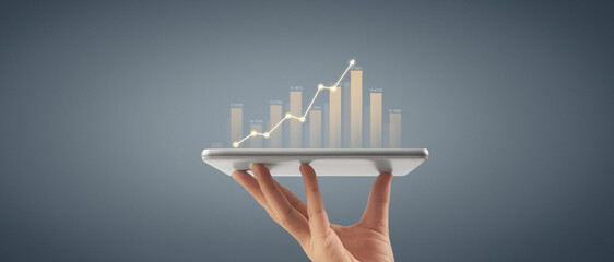 Plan graph growth and increase of chart positive indicators ,tablet in hand