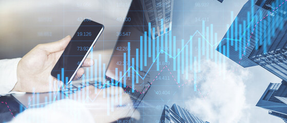 Aufkleber - Close up of male hands using laptop and cellphone on abstract wide city background with forex chart and grid. Financial growth, technology and communication concept. Double exposure.