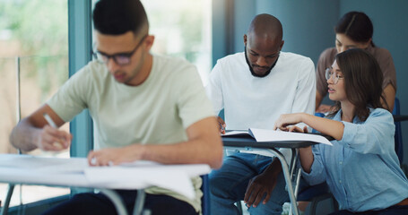 Notebook, student help and education test in a classroom with writing and teacher learning at university. College exam, school professor and male person with document in a lecture hall with paper