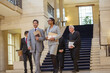 © KOTO - Judges and lawyer walking through courthouse
