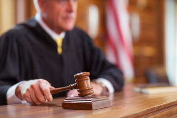 Judge banging gavel in court 