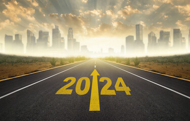 2024 year goals concept. 2024 year lettering with arrow on Asphalt road. City skyline with skyscrapers in the background. Plan, goal, task and path to success as you enter the new year