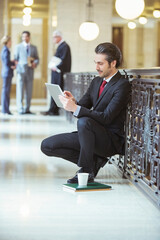 Wall Mural - Lawyer doing work on digital tablet in courthouse