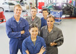 Portrait confident mechanics in auto repair shop