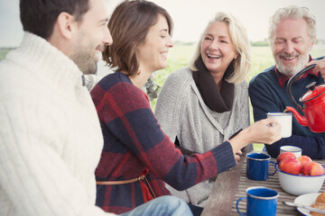 Wall Mural - Couples drinking coffee on patio