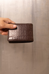 Wall Mural - Man hand open an empty wallet on white background