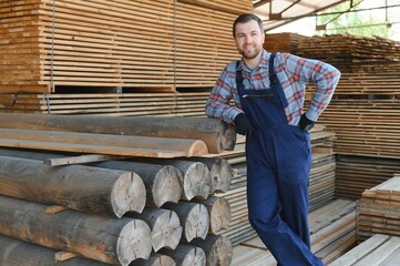 Wall Mural - Carpenter in uniform check boards on sawmill