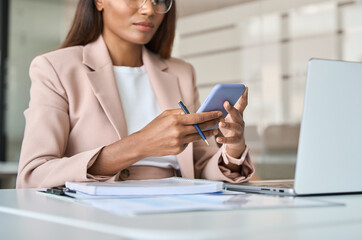 young busy professional african american business woman executive manager holding cellphone using mo