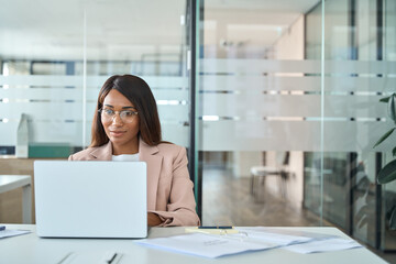professional business woman employee working on computer in office. young busy african american fema