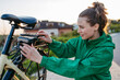 © Halfpoint - Young woman with electro bicycle, concept of commuting and ecologic traveling.