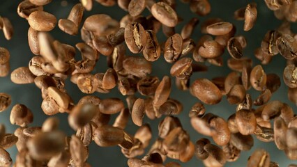 Aufkleber - Super slow motion of rotating coffee beans on black background. Filmed on high speed cinema camera, 1000 fps placed on high speed cine bot.  Camera moving up with rotation. 