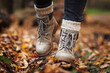 Leinwandbild Motiv Leather hiking boot with knitted socks. Walking in autumn forest