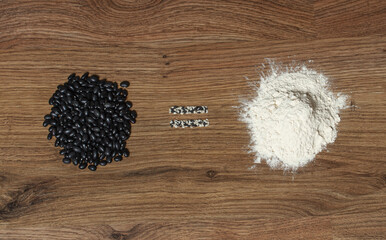 Wall Mural - Black beans equals natural protein, concept background.