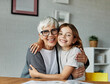 © Lumos sp - grandchild granddaughter grandma grandmother portrait  girl senior love family bonding daughter hugging hug