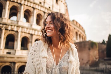 Wall Mural - Portrait of happy young woman in front of Colosseum in Rome, Italy