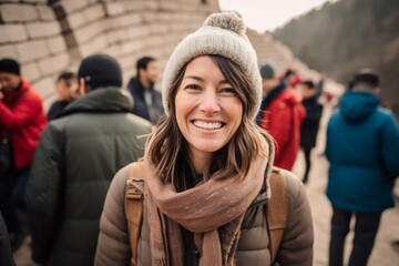 Wall Mural - Portrait of a young woman at the Great Wall in Beijing, China