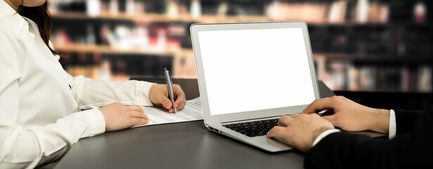 Poster - Empty laptop computer screen for astute design mockup on a table in library of university