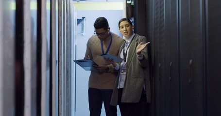 Wall Mural - Woman manager in server room with man, talking and network administration for database update. Tech employees, system maintenance and technician team problem solving online in data center together.