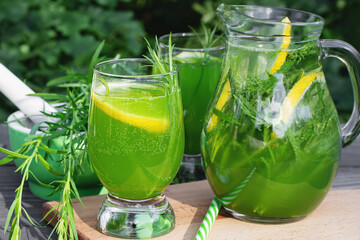 Wall Mural - Homemade summer refreshing tarragon lemon drink on patio table