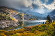 © Andrew Kornylak - A man standing on the shore of Lake Isabelle, Indian Peaks Wilderness, Colorado