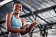 Black woman, portrait or personal trainer with a tablet for fitness training, workout or sports exercise. Results, digital technology app or happy gym instructor planning a online coaching schedule