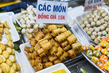 Wall Mural - Many snacks and seafood in vietnamese night market in food festival, sign 