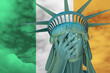 Statue of Liberty. Facepalm emoji on background in colors of Ireland flag