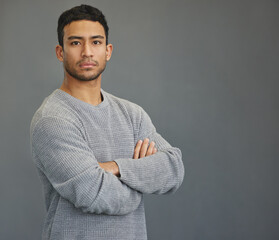 Sticker - Serious portrait of man in studio with mockup, arms crossed and model on studio backdrop in casual fashion. Relax, confidence and face of male on grey background with focus, pride and mock up space.