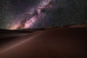 Amazing views of the Sahara desert under the night starry sky.