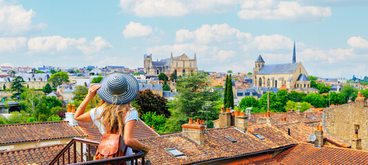 Wall Mural - poitiers city landscape- woman looking at urban skyline- france