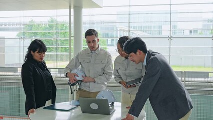 Poster - Group of multinational engineers and business people meeting in a building. International business.