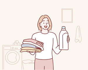 woman holding folded clothes and detergent bottle at laundry roomHand drawn style vector design illustrations.