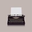 Vintage typewriter with paper on a gray background.