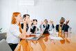 © jaimelafrickmartial  - A positive group of interracial business people in yoga pose in the office.