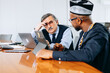 © jaimelafrickmartial  - Two stressed real interracial businessmen thinking how to solve problem while in company , face business challenges.