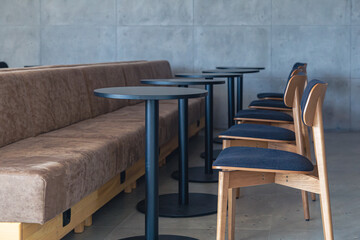 Wall Mural - Interior of a modern cafe with sofas, chairs and tables.