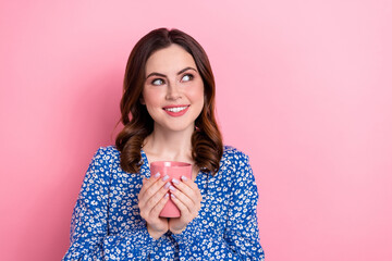 Canvas Print - Portrait of pretty positive lady toothy smile arms hold fresh coffee cup look empty space isolated on pink color background