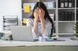 © PHAISITSAWAN - Concept Burnout Syndrome. Asian business Woman feels uncomfortable working. Which is caused by stress, accumulated from unsuccessful work And less resting body. Consult a specialist psychiatrist.