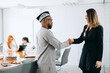 © jaimelafrickmartial  - African businessman making a deal with a business woman.