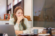 © Pichsakul - Business concept, Woman entrepreneur sleepy and yawning while overworked in coworking space office