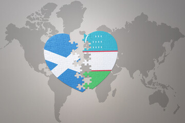 puzzle heart with the national flag of uzbekistan and scotland on a world map background.Concept.