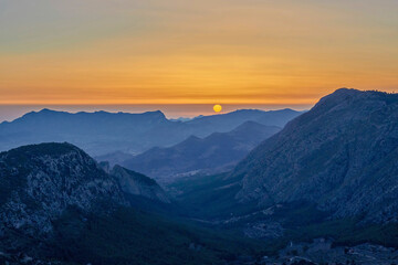 Sunset in the Sierra del Malladar near the penyo roc and el pas of the contador. In the province of Alicante, Benimantell, Spain.