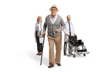 Wall Mural - Healthy elderly male patient walking and doctors standing in the back
