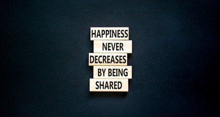Wall Mural - Happiness symbol. Concept words Happiness never decreases by being shared on wooden block. Beautiful black table black background. Motivational Happiness concept. Copy space.