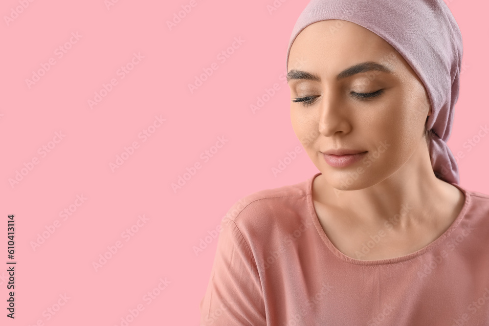 Young woman after chemotherapy on pink background, closeup